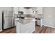 Modern kitchen with stainless steel appliances and an island at 7238 Arkansas St, Frederick, CO 80530