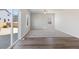 Living room with hardwood and carpeted floors and sliding glass door to backyard at 7238 Arkansas St, Frederick, CO 80530