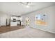 Spacious living room with hardwood and carpeted floors, and sliding glass door access to backyard at 7238 Arkansas St, Frederick, CO 80530