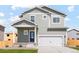 Two-story home with grey siding and a two-car garage at 7238 Arkansas St, Frederick, CO 80530