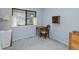 Simple bedroom with a window and wood desk and chair at 4009 Wonderland Hill Ave, Boulder, CO 80304