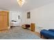 Bright basement bedroom with a comfortable bed and plenty of room for storage at 4009 Wonderland Hill Ave, Boulder, CO 80304