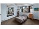 Charming bedroom with large window and built-in bookshelves at 4009 Wonderland Hill Ave, Boulder, CO 80304