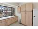 Well-equipped kitchen featuring ample cabinetry and a window with outdoor views at 4009 Wonderland Hill Ave, Boulder, CO 80304