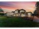 Modern home exterior with stone and sleek design at dusk at 1590 Sumac Ave, Boulder, CO 80304
