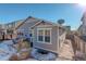 Rear view of the house showcasing a patio and landscaping at 5233 E 140Th Pl, Thornton, CO 80602