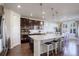 Kitchen island with granite countertop and seating for three at 5233 E 140Th Pl, Thornton, CO 80602