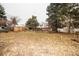 Large backyard with mature trees and a view of the house at 4263 S Elati St, Englewood, CO 80110