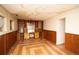 Unfinished basement with wood paneling and built-in shelving at 4263 S Elati St, Englewood, CO 80110