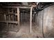 Unfinished basement with exposed pipes and wooden shelving at 4263 S Elati St, Englewood, CO 80110