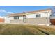 Newly remodeled ranch home with gray and white exterior, and attached garage at 9120 Judson St, Westminster, CO 80031