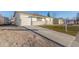 Newly remodeled ranch home with gray and white exterior, and attached garage at 9120 Judson St, Westminster, CO 80031