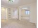 Bright bedroom with mirrored closet doors and neutral walls at 6861 Tiger Walk, Lone Tree, CO 80124