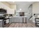 Modern kitchen with stainless steel appliances and an island at 20040 E Wagontrail Dr, Centennial, CO 80015