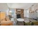 Living room with stone fireplace, hardwood floors, and neutral decor at 20040 E Wagontrail Dr, Centennial, CO 80015