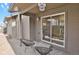 Private backyard patio with seating area and sliding glass door access at 4750 E Louisiana Ave, Denver, CO 80246