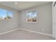 Bright bedroom with neutral gray walls and carpet at 4750 E Louisiana Ave, Denver, CO 80246