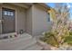 Gray house exterior with landscaping and modern door at 4750 E Louisiana Ave, Denver, CO 80246