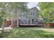 Spacious backyard with a large deck and mature trees at 2599 S Jebel Way, Aurora, CO 80013