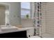 Clean bathroom with a shower/tub combo and updated vanity at 2599 S Jebel Way, Aurora, CO 80013