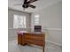 Home office with built-in desk and large window at 2599 S Jebel Way, Aurora, CO 80013