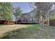View of the home's backyard, showcasing the deck and landscaping at 2599 S Jebel Way, Aurora, CO 80013