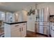 Kitchen boasts stainless steel refrigerator and white cabinetry at 2599 S Jebel Way, Aurora, CO 80013