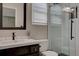 Updated bathroom with a walk-in shower, vanity, and modern fixtures at 2599 S Jebel Way, Aurora, CO 80013