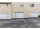 Row of garages with doors and individual entrances at 8199 Welby Rd # 2304, Denver, CO 80229