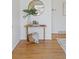 Bright and airy entryway with a wooden console table and a large mirror at 5570 Holland Dr, Arvada, CO 80002