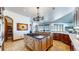 Spacious kitchen with an island, custom cabinetry, and views at 7755 Moore Rd, Littleton, CO 80125