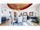 Elegant dining room features a round table, chandelier, and ornate ceiling details at 7755 Moore Rd, Littleton, CO 80125
