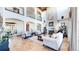 Two-story living area with high ceilings and a grand fireplace at 7755 Moore Rd, Littleton, CO 80125