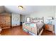 Bedroom with hardwood floors and built-in wardrobe at 7755 Moore Rd, Littleton, CO 80125