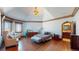 Bright bedroom with hardwood floors, large windows and ensuite bathroom at 7755 Moore Rd, Littleton, CO 80125