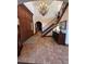 Elegant two-story entry with a chandelier, hardwood floors, and a grand staircase at 7755 Moore Rd, Littleton, CO 80125