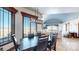 Bright dining room with large windows, mountain views and seating for six at 7755 Moore Rd, Littleton, CO 80125