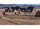 Luxury home nestled in mountain landscape at 7755 Moore Rd, Littleton, CO 80125
