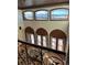 High-ceilinged living room with expansive windows and mountain views at 7755 Moore Rd, Littleton, CO 80125
