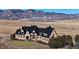 Luxury home with mountain views and circular driveway at 7755 Moore Rd, Littleton, CO 80125