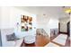 Upper hallway with seating area and hardwood floors at 7755 Moore Rd, Littleton, CO 80125