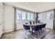 Dining room with large windows and seating for six at 1337 Brookfield Pl, Erie, CO 80026