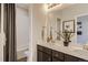 Double vanity bathroom with a shower and toilet at 1337 Brookfield Pl, Erie, CO 80026