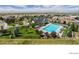 Community pool with clubhouse and surrounding green space at 1122 S Fultondale Cir, Aurora, CO 80018