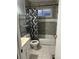 Bathroom with a shower/tub combo and gray tiled walls at 241 Birch St, Bennett, CO 80102