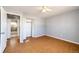 Simple bedroom with hardwood floors and a spacious closet at 241 Birch St, Bennett, CO 80102