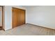 Spacious bedroom with double door closet and neutral carpeting at 432 S 8Th St, Berthoud, CO 80513