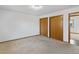 Carpeted bedroom with double door closet and backyard view at 432 S 8Th St, Berthoud, CO 80513