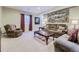 Finished basement with comfy seating and a coffee table at 6655 S Shawnee St, Aurora, CO 80016