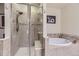 Bathroom with shower and tub, tile flooring, and glass door at 6655 S Shawnee St, Aurora, CO 80016